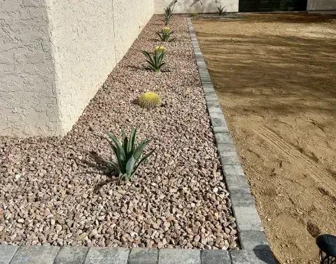 Gravel landscape installation covering designated areas of a residential property