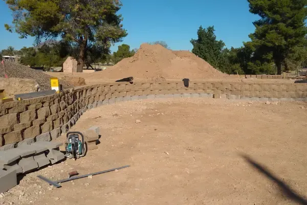 Landscape retaining wall creating structure and definition within a yard