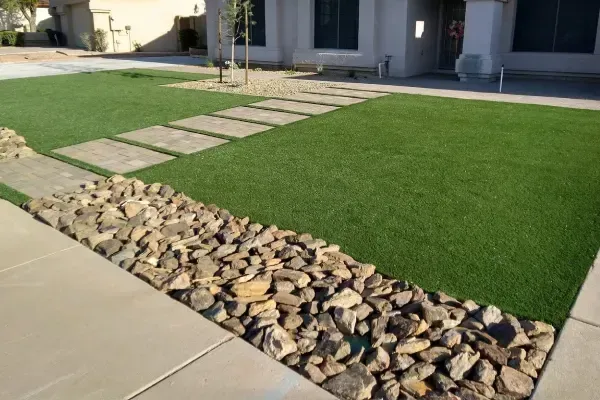 Landscape rock installation adding texture and definition to a residential yard