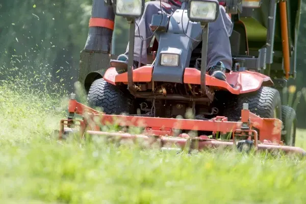 Residential lawn mowing service keeping grass evenly trimmed