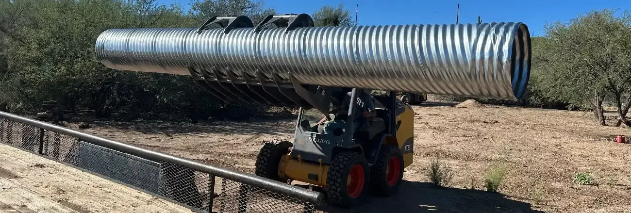 Yard drainage system directing excess water away from a residential property