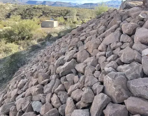Yard grading and erosion control managing water flow across the property