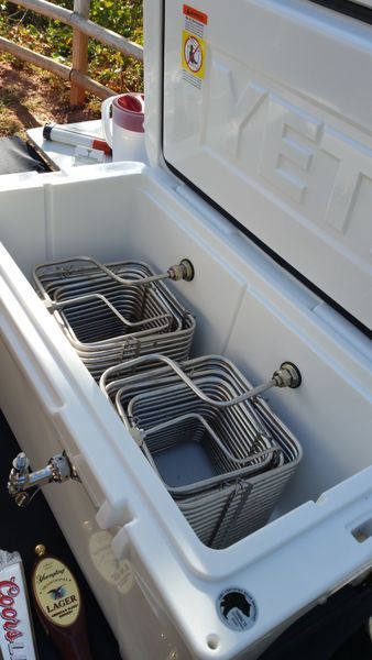 A white yeti cooler with a bunch of baskets inside of it