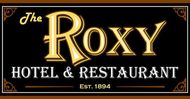 A sign for the roxy hotel and restaurant