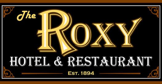 A sign for the roxy hotel and restaurant
