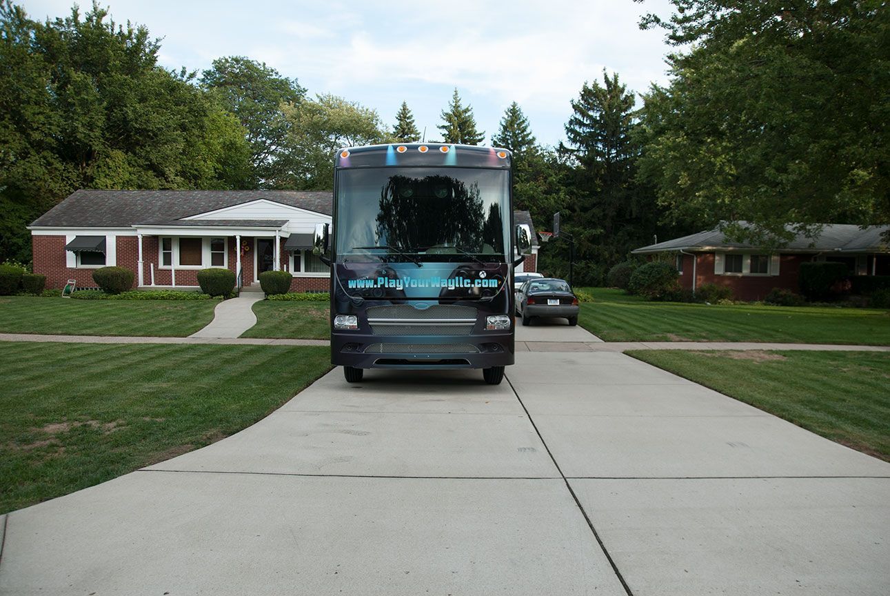 play your way bus parked in the driveway