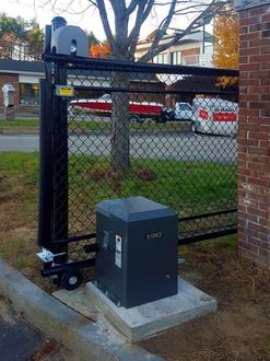 A sliding gate with a box that says abc on it