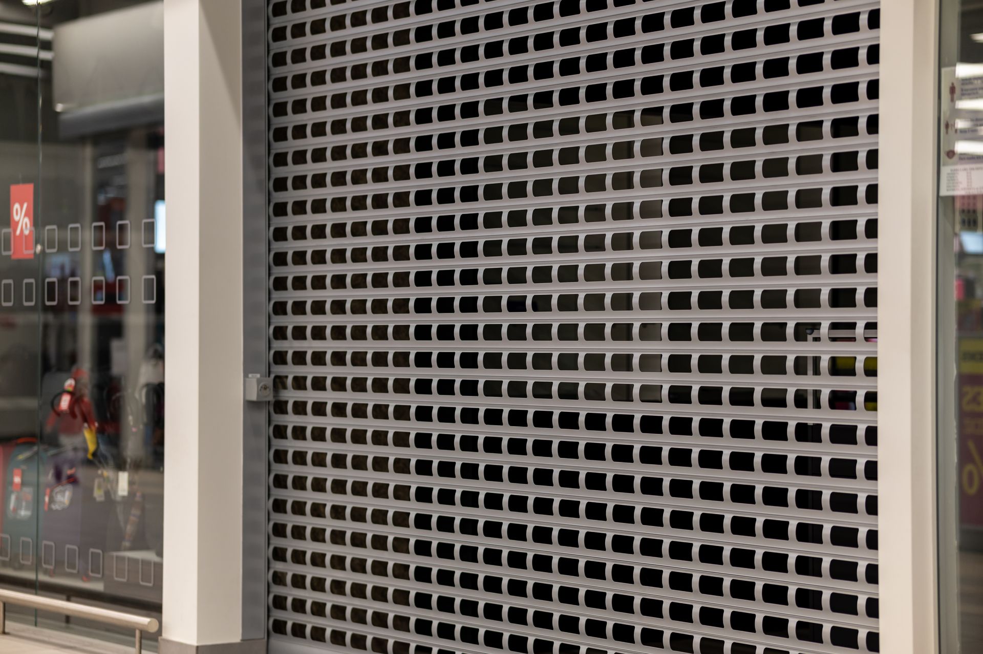 A close up of a roller shutter on the side of a building.