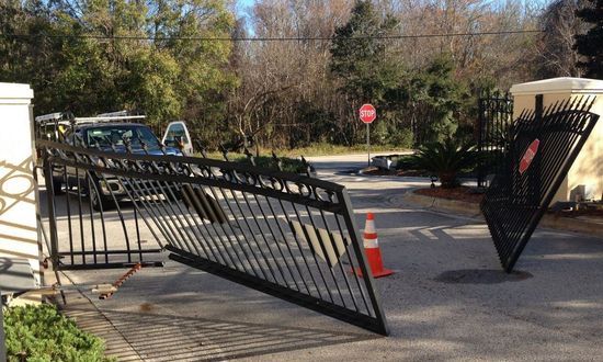 A broken gate is sitting on the side of the road