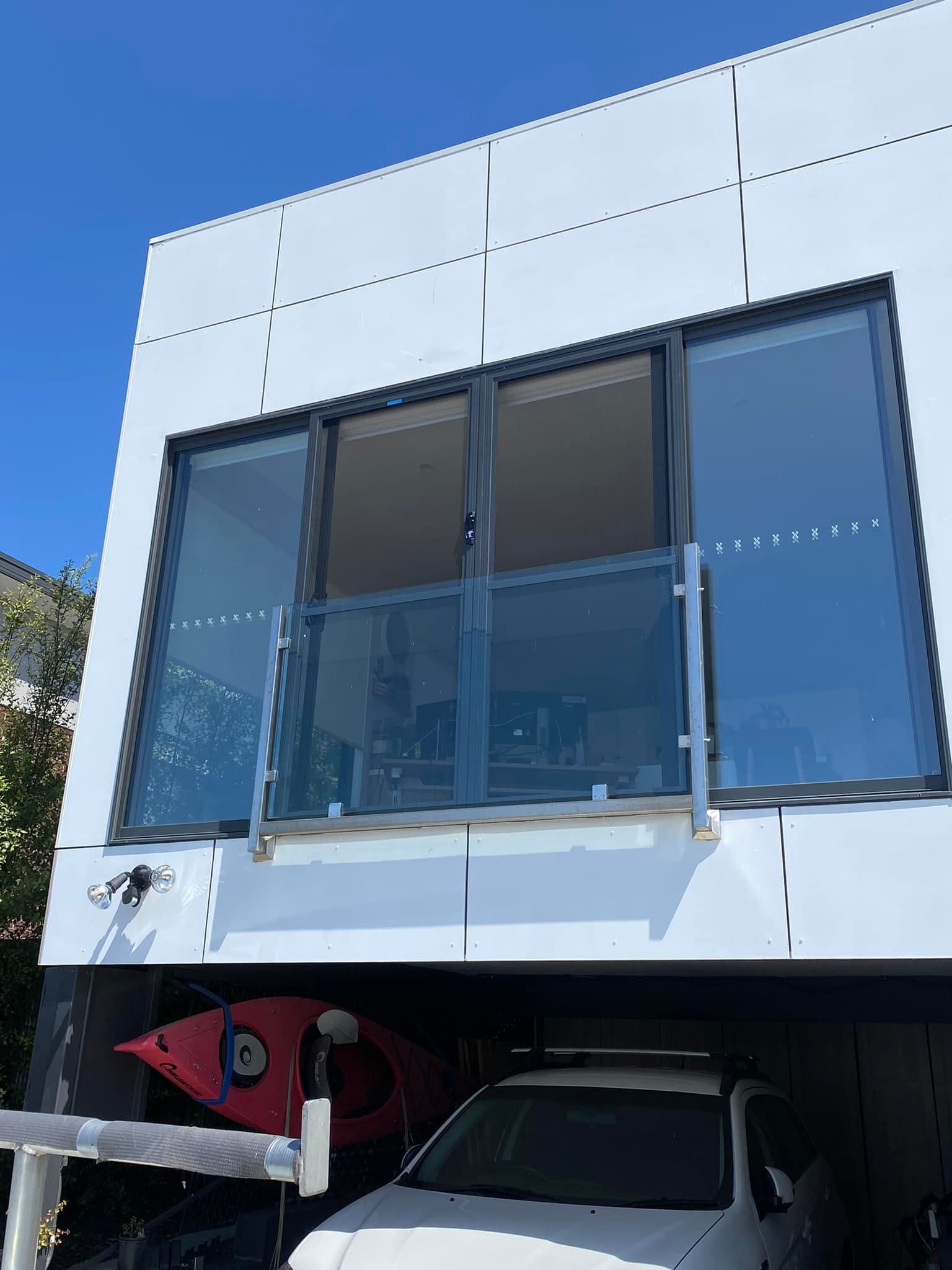 A White Building Exterior — Rodens Repairs Flyscreens and Doors In Forcett, TAS