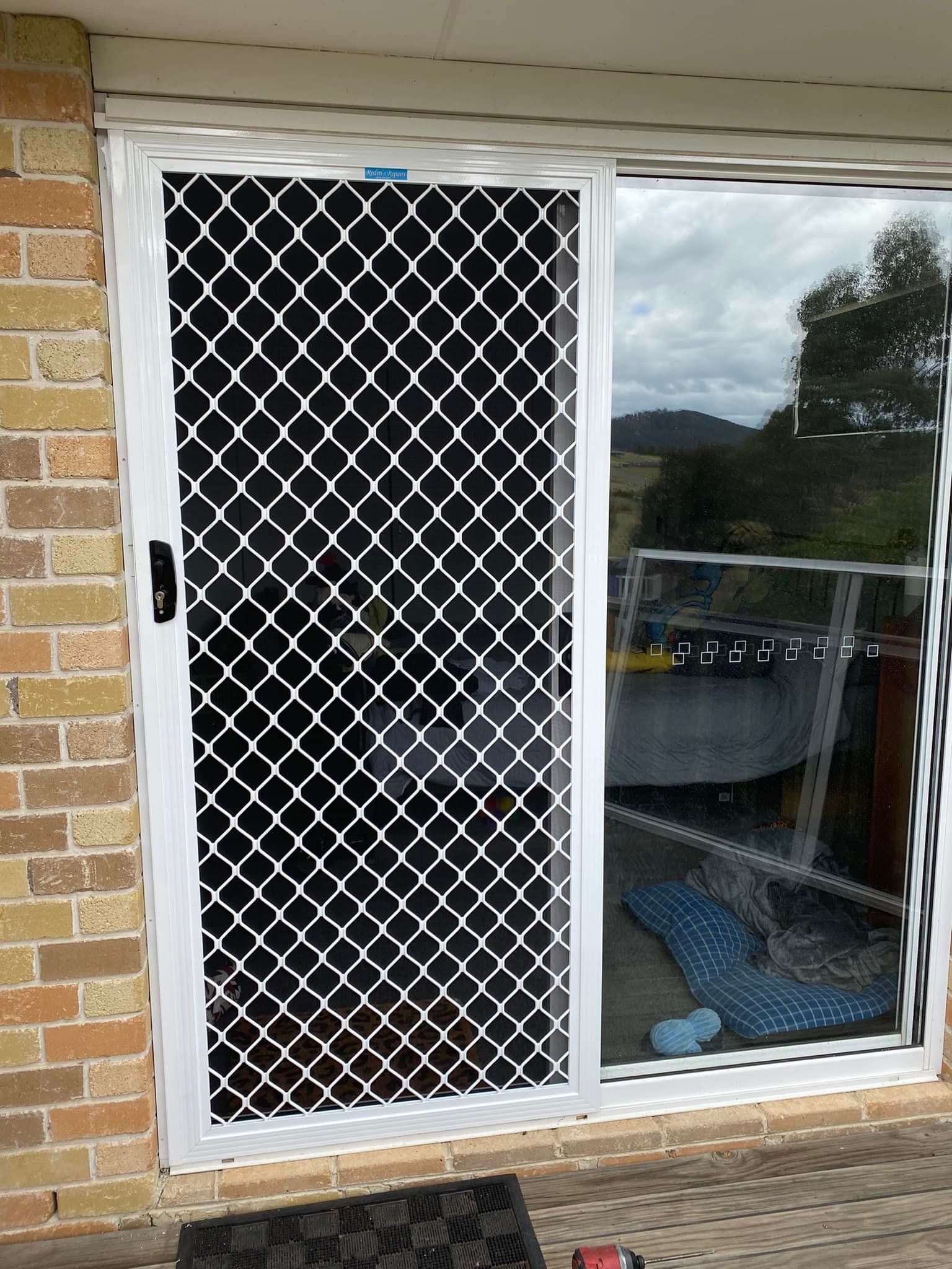 White Sliding Security Screen Door — Rodens Repairs Flyscreens and Doors In Forcett, TAS