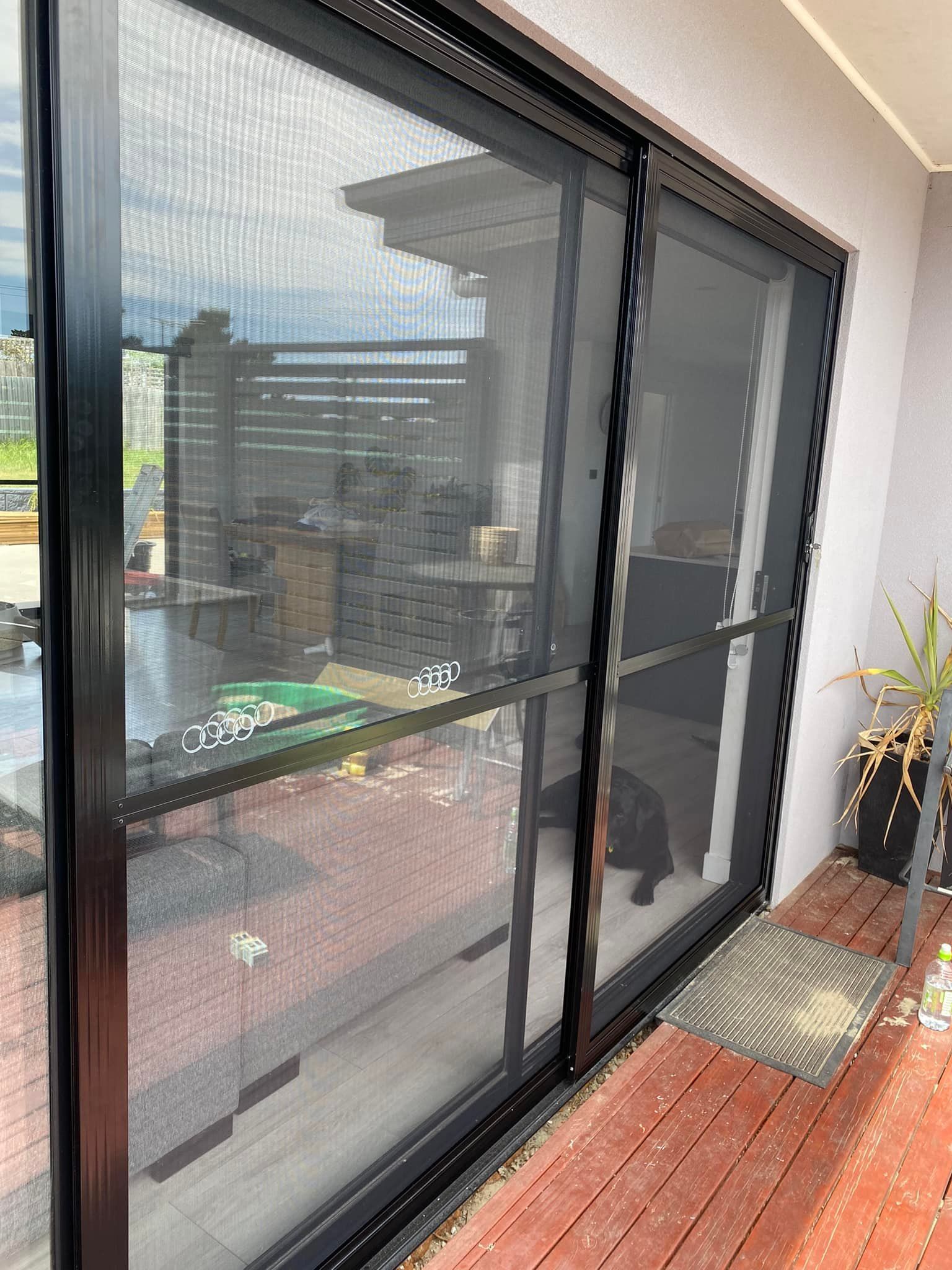A Black Framed Sliding Screen Door — Rodens Repairs Flyscreens and Doors In Forcett, TAS