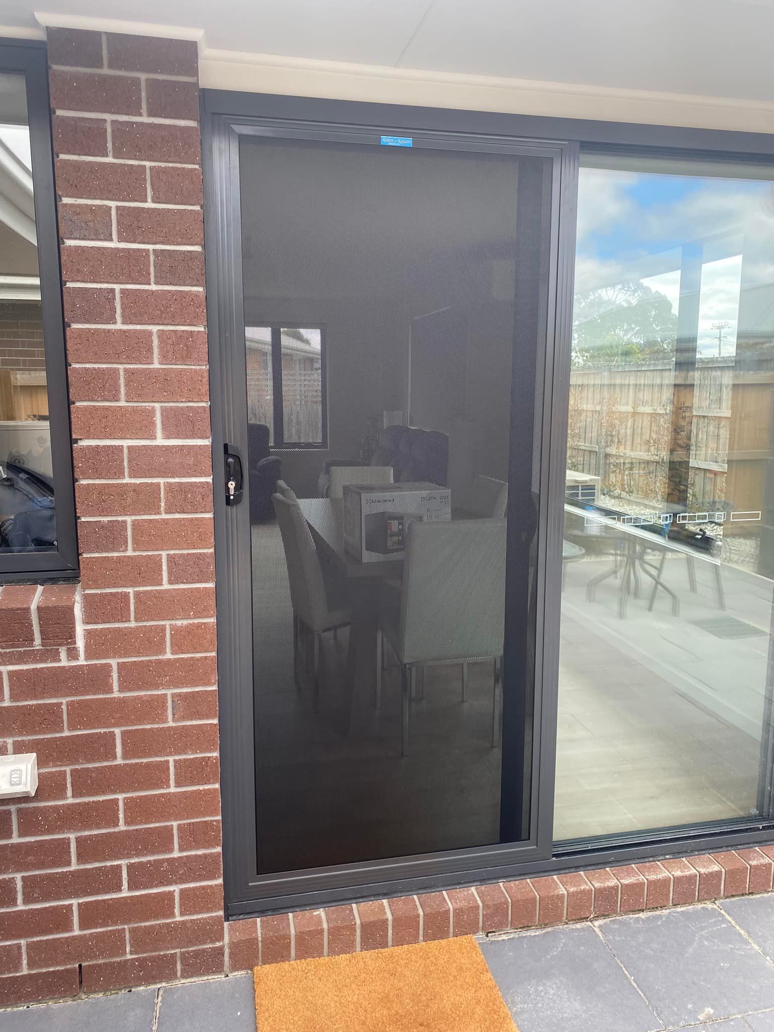 A Black Mesh Security Screen Door — Rodens Repairs Flyscreens and Doors In Forcett, TAS