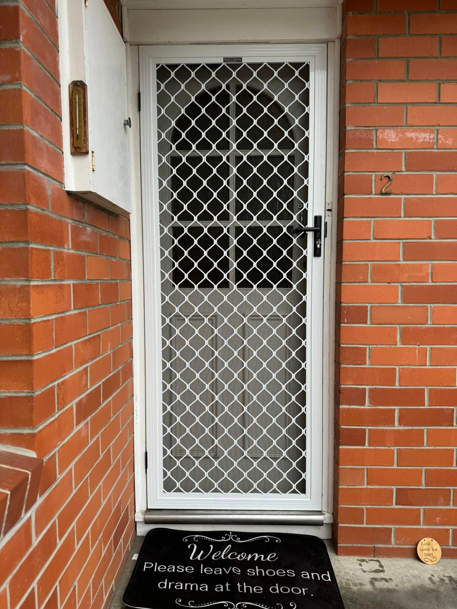 A White Security Screen Door — Rodens Repairs Flyscreens and Doors In Forcett, TAS