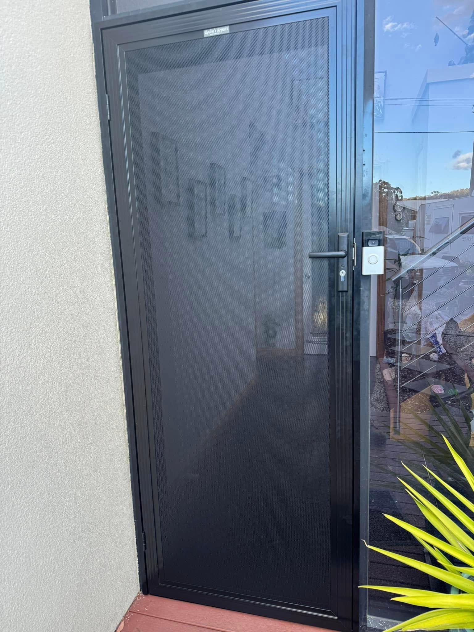 Black Metal Security Screen Door — Rodens Repairs Flyscreens and Doors In Forcett, TAS