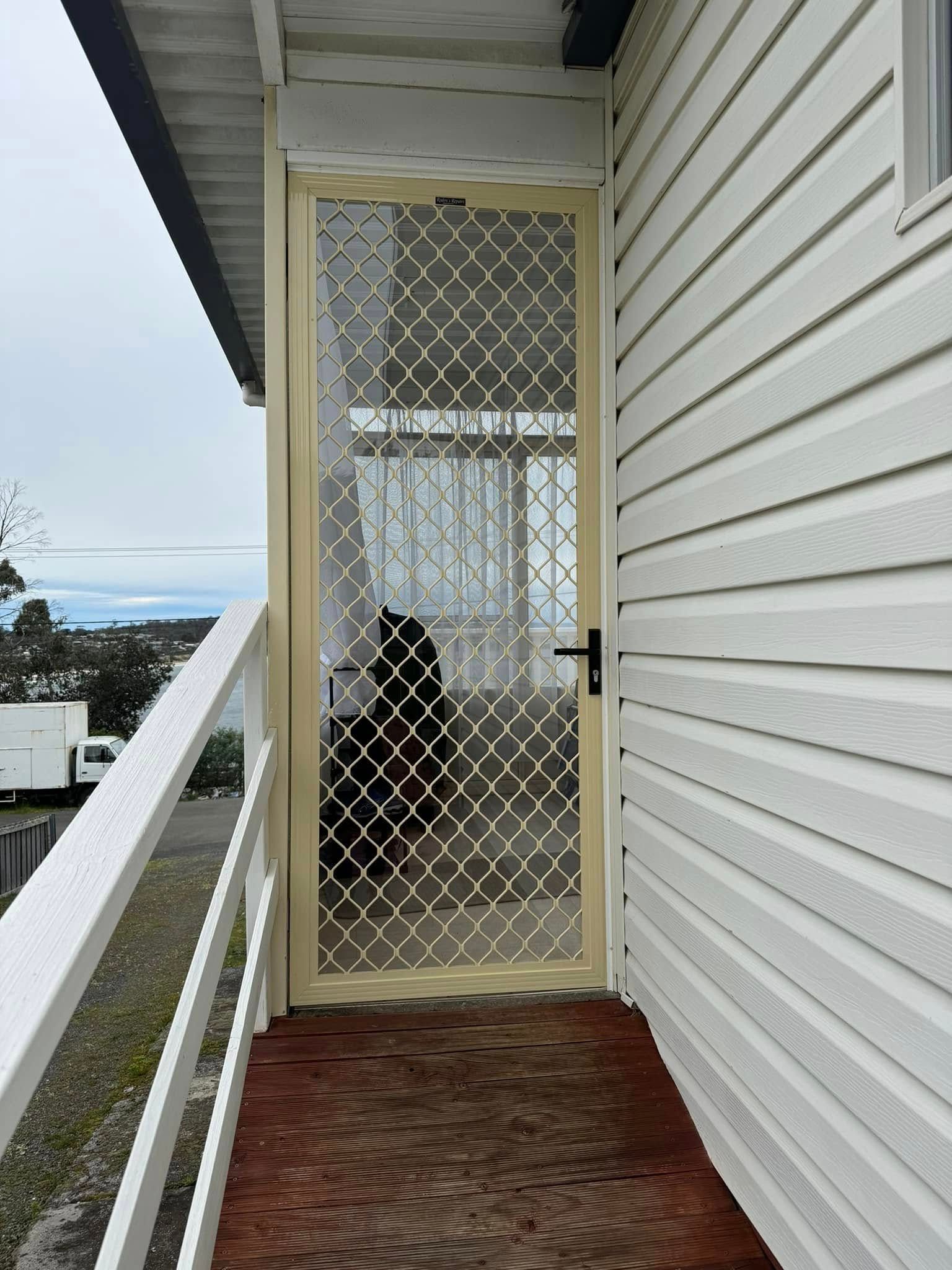 A Cream Security Screen Door — Rodens Repairs Flyscreens and Doors In Forcett, TAS