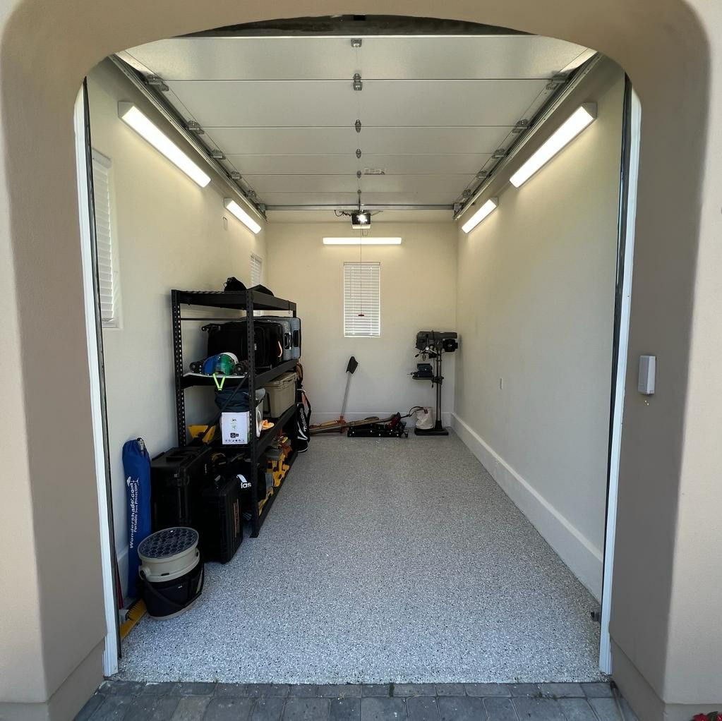 The inside of a garage with the door open