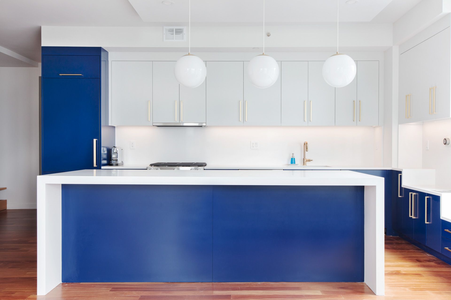 A kitchen with wooden cabinets and stainless steel appliances.