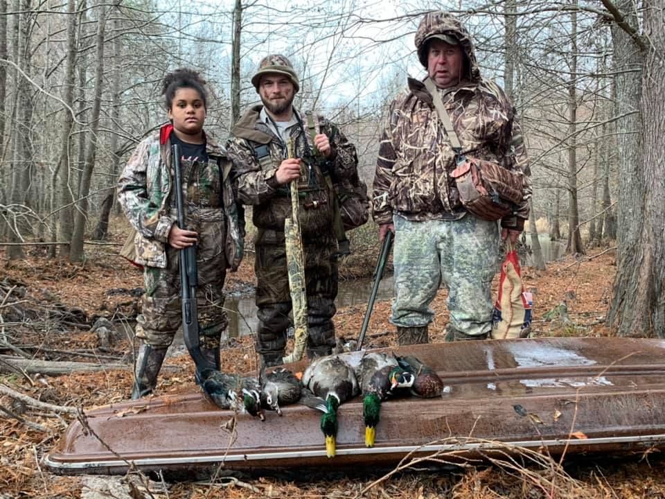 Three People Hunt a Ducks