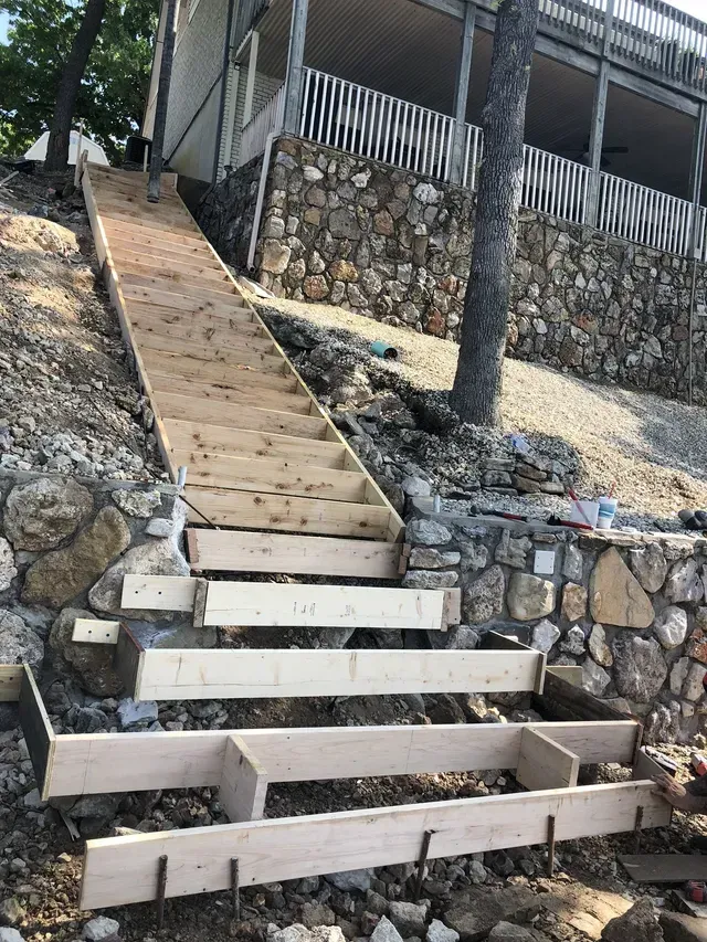 wooden boards set up for retaining wall/steps construction