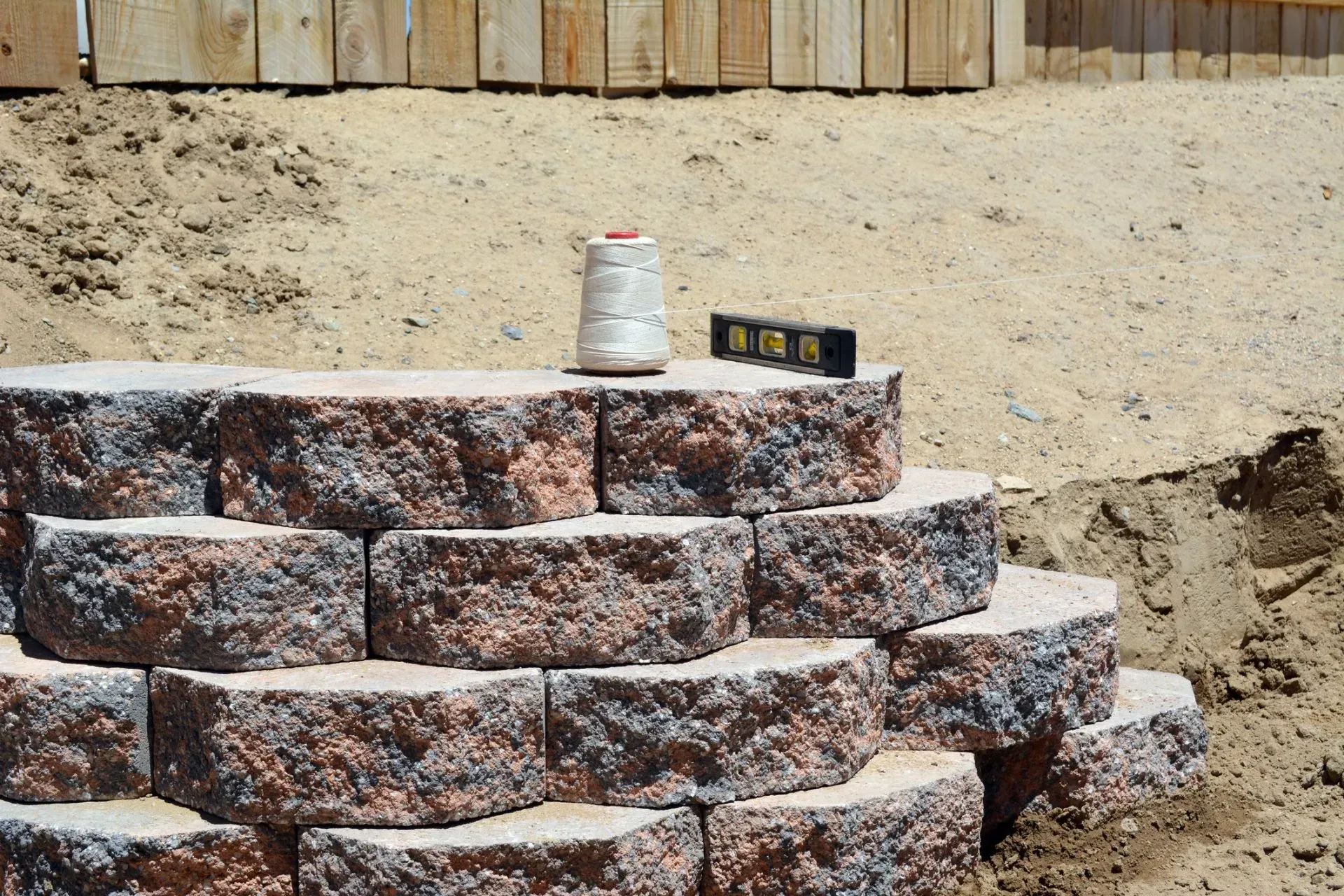 Beginnings of a retaining wall with leveling string laid out