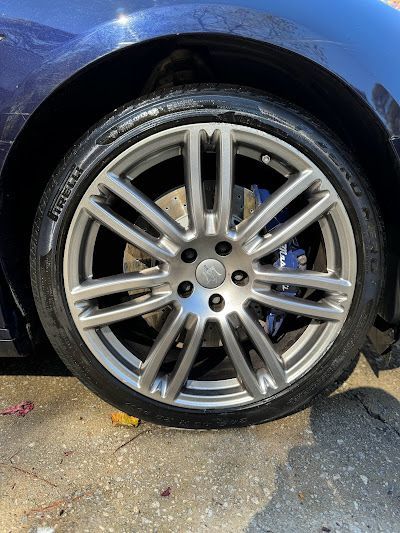 A close up of a car wheel with a tire on it.
