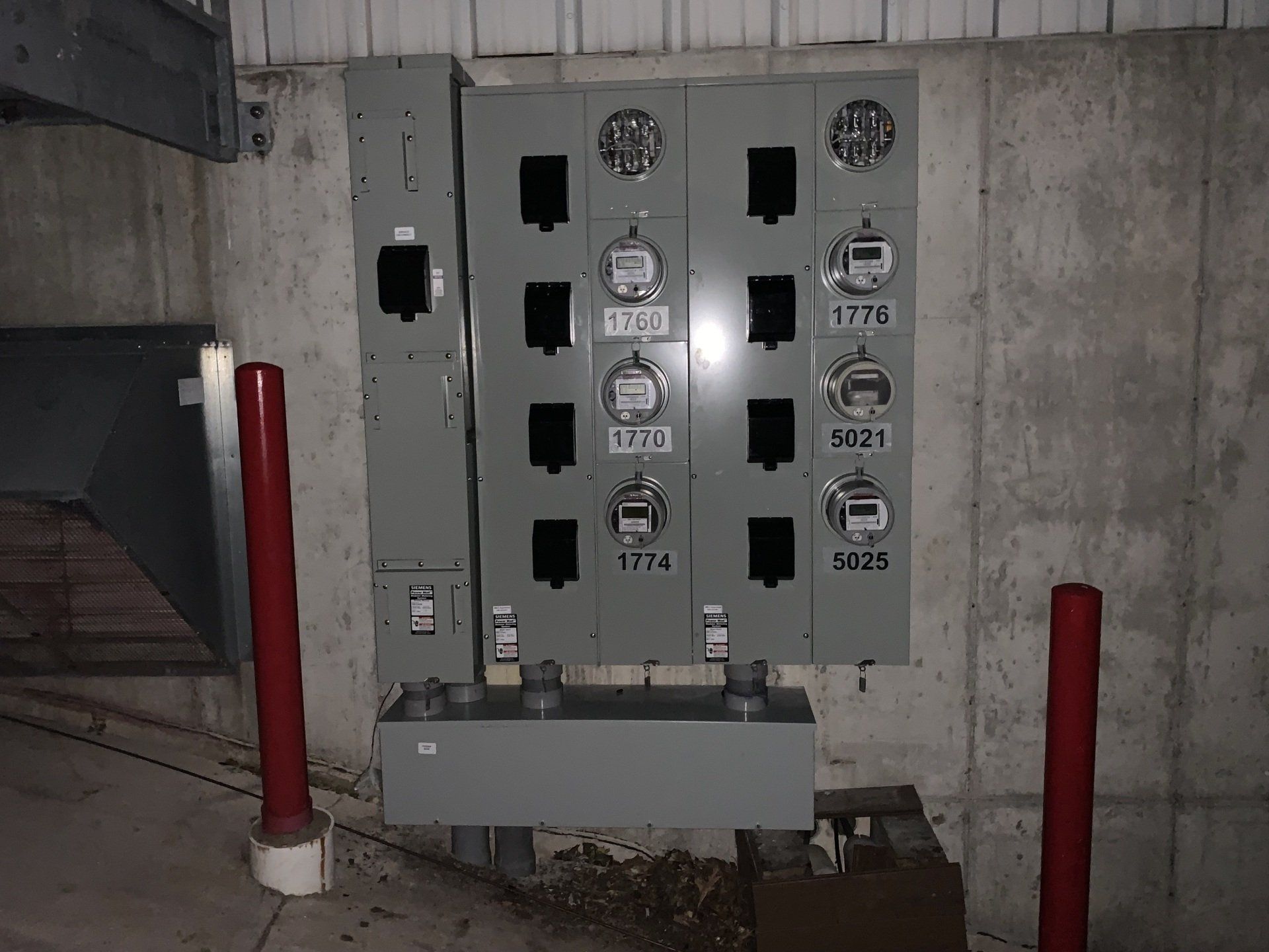 A wall with a bunch of electrical boxes on it