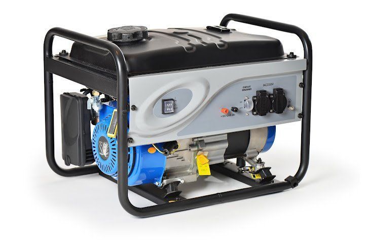 A small portable generator is sitting on a white surface.