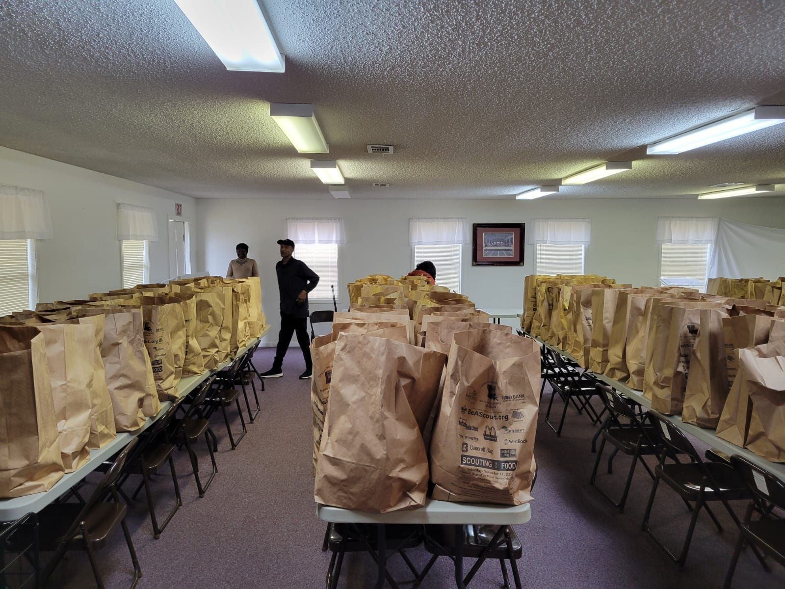 A room filled with lots of brown bags on tables