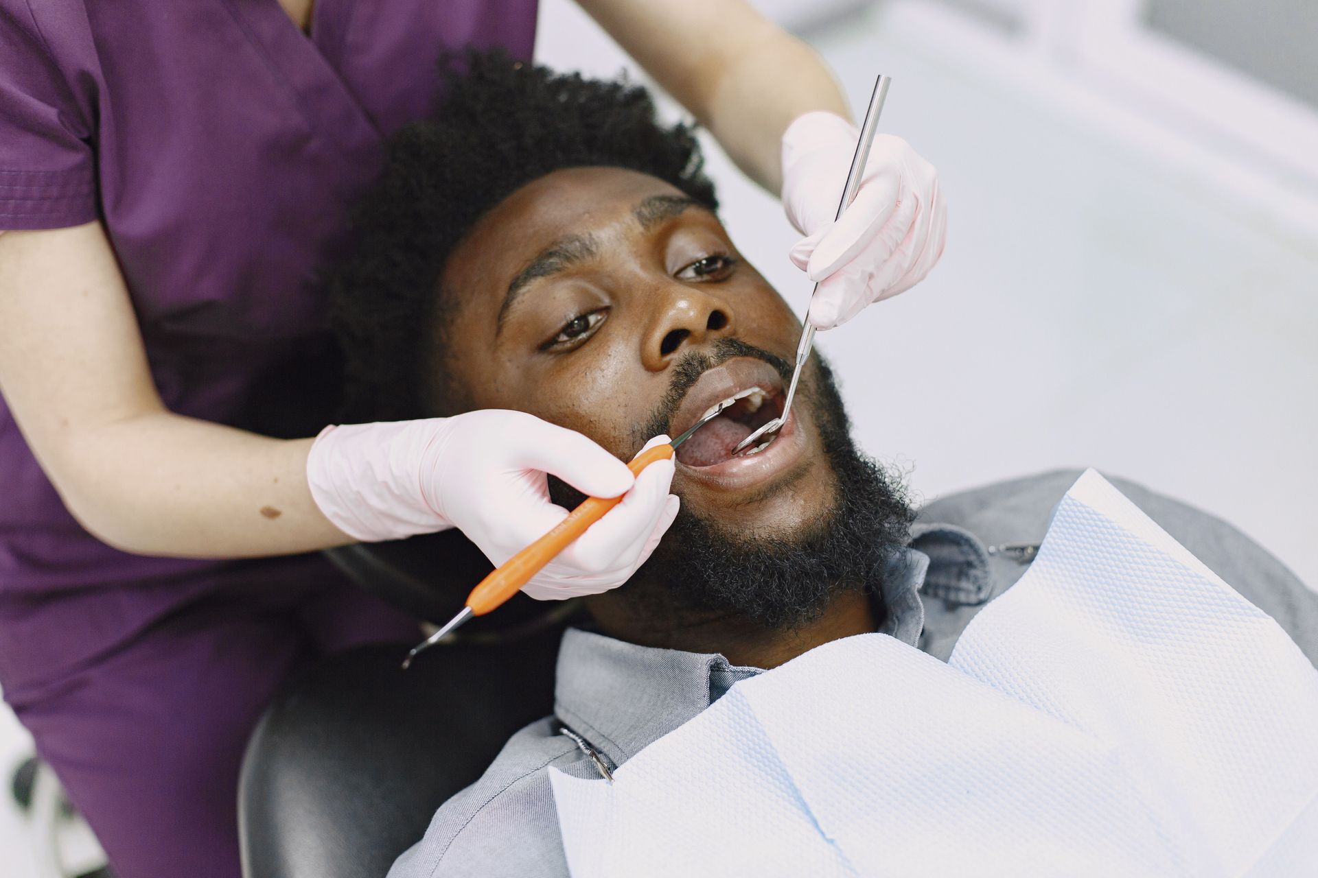 Patient receiving emergency dental care in Fayetteville, NC.