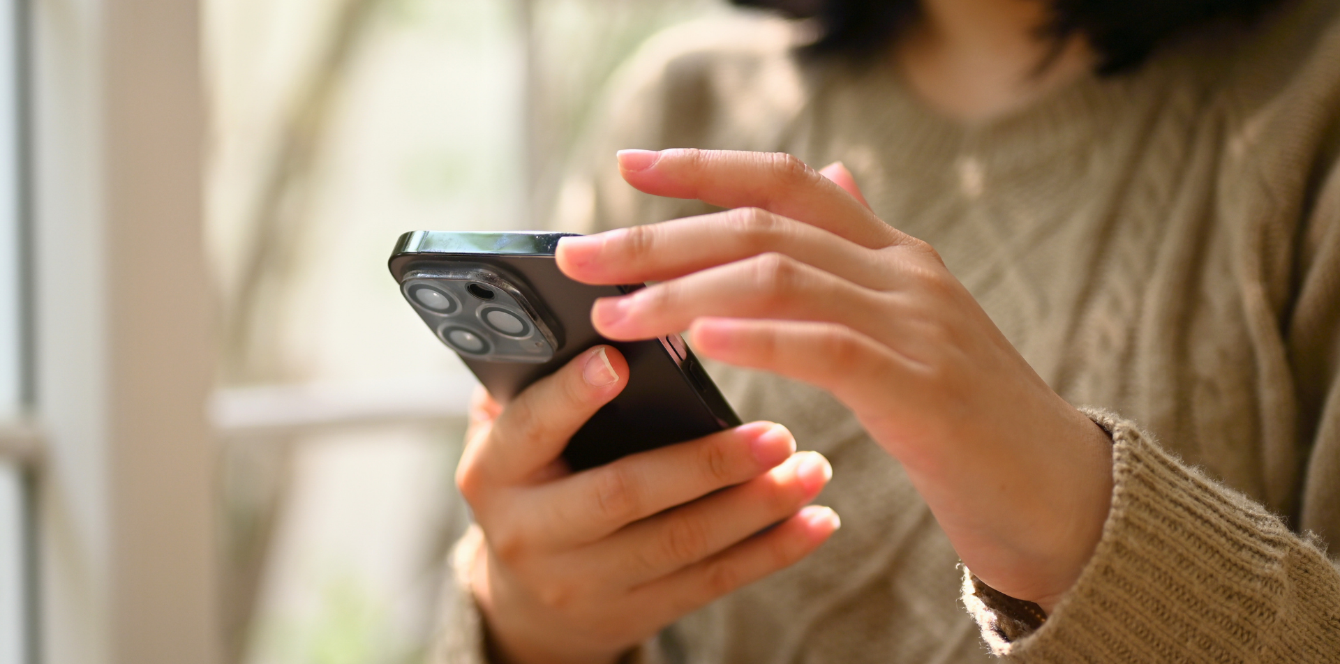 Woman scrolling on phone