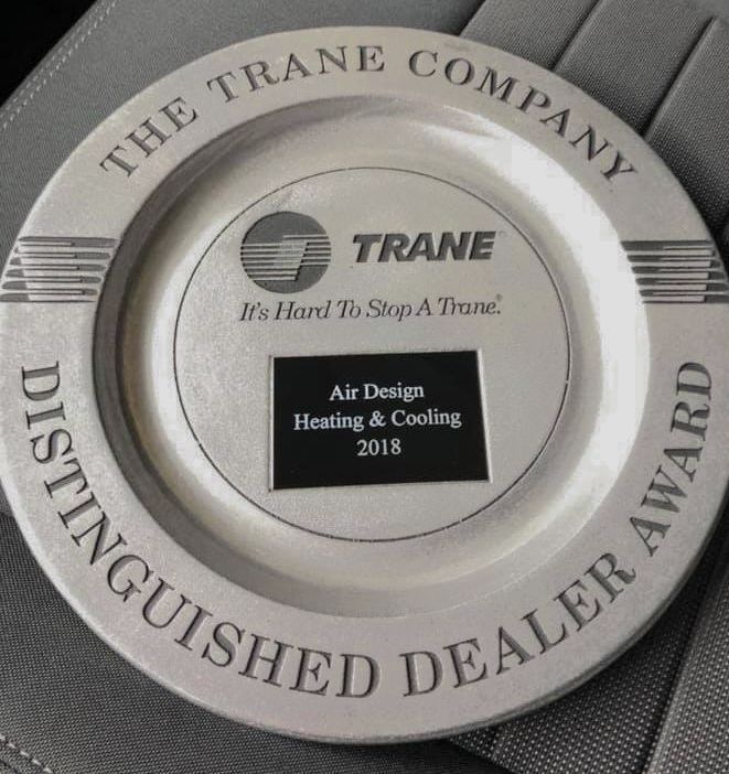 A plate that says the trane company on it