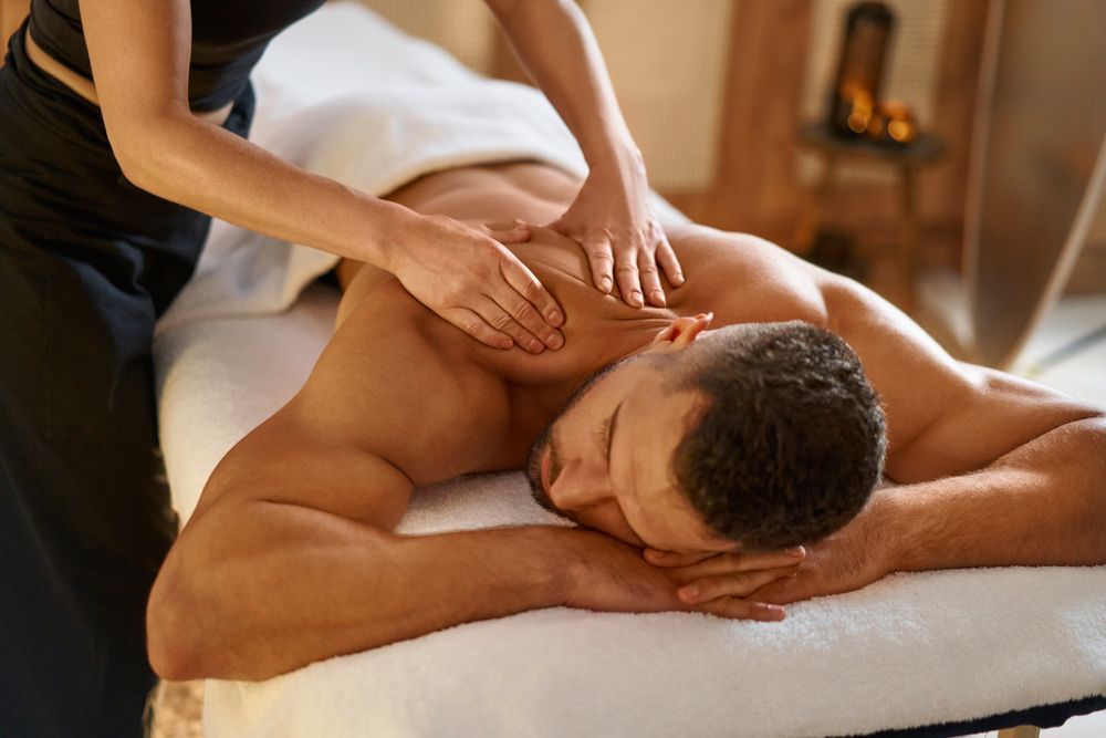 A man is getting a massage at a spa.