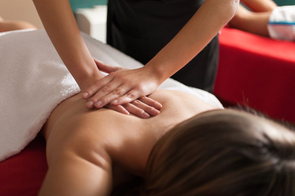 A woman is getting a massage at a spa.