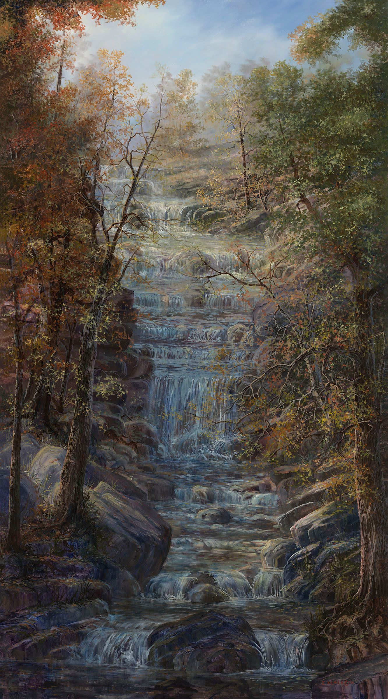 Autumn forest waterfall cascading over rocks, framed by colorful trees and misty light