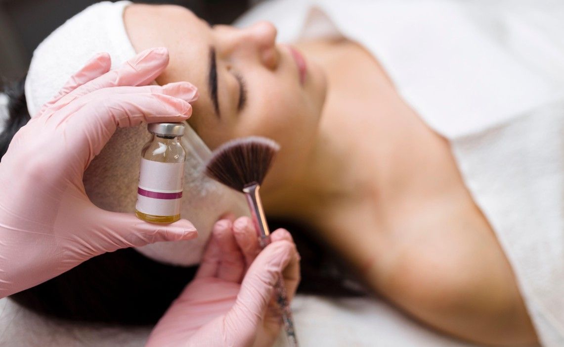 The Skin Studio applying BioRePeel serum.