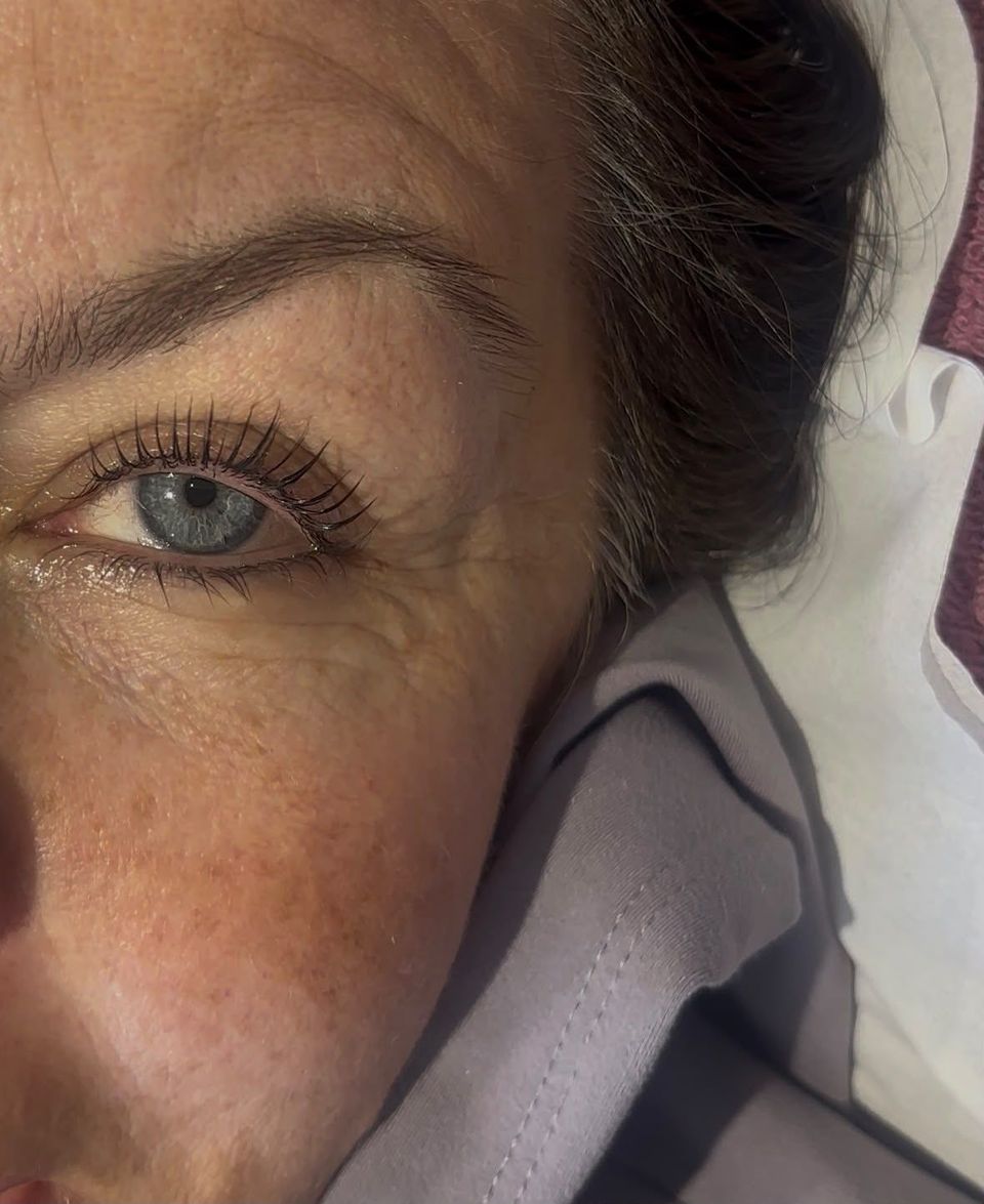 Close-up of lifted and tinted natural lashes after a lash lift and tint