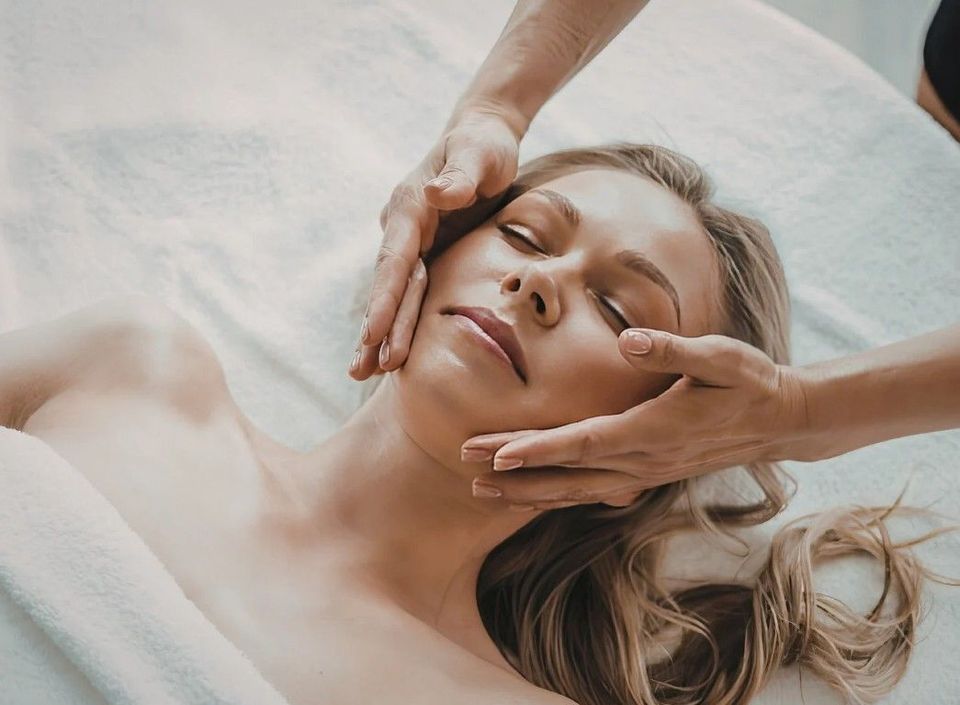 Aftercare moisturiser being applied to a client's face