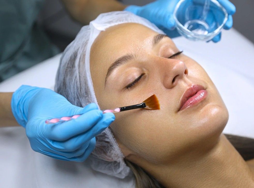 The Skin Studio applying Salicylic acid serum.