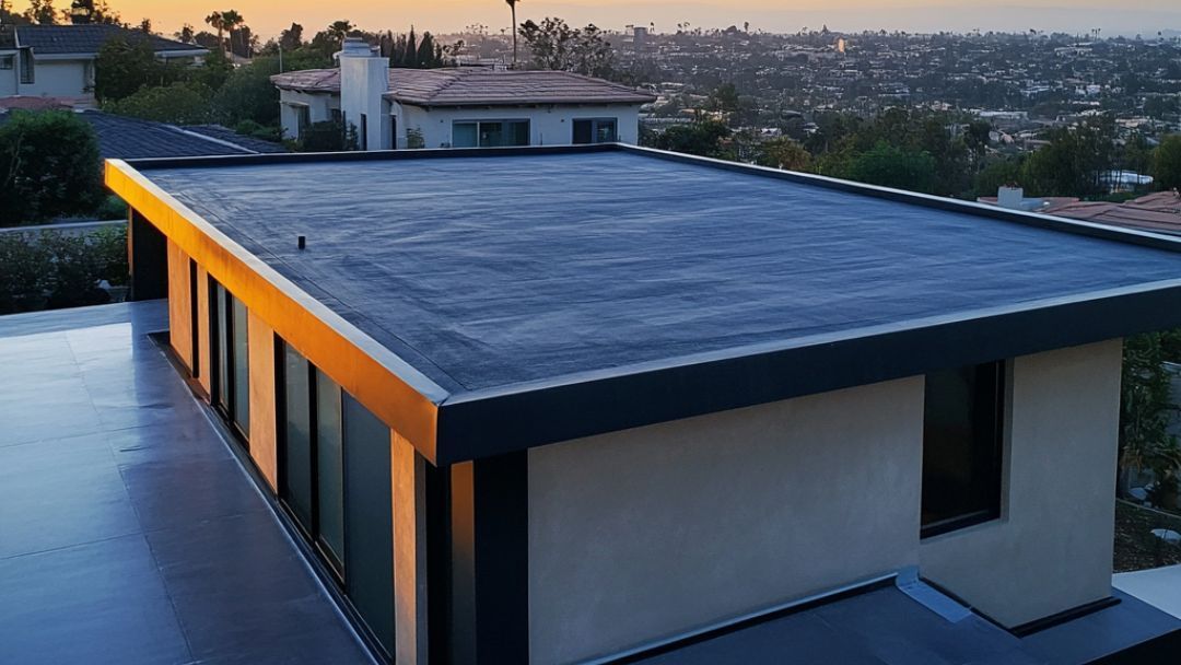 Modern building with a dark, flat roof and large windows, overlooking a cityscape.