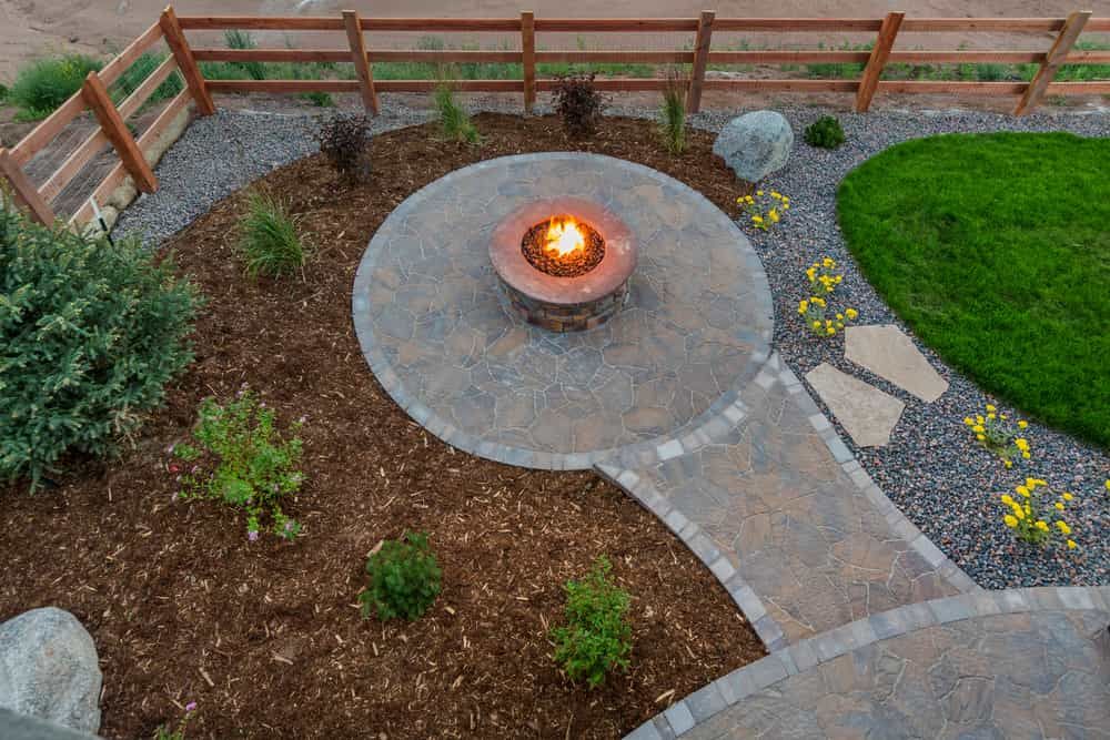 A Fire Pit in The Middle of The Garden — Peter Phillips Landscape Design in Bomaderry, NSW
