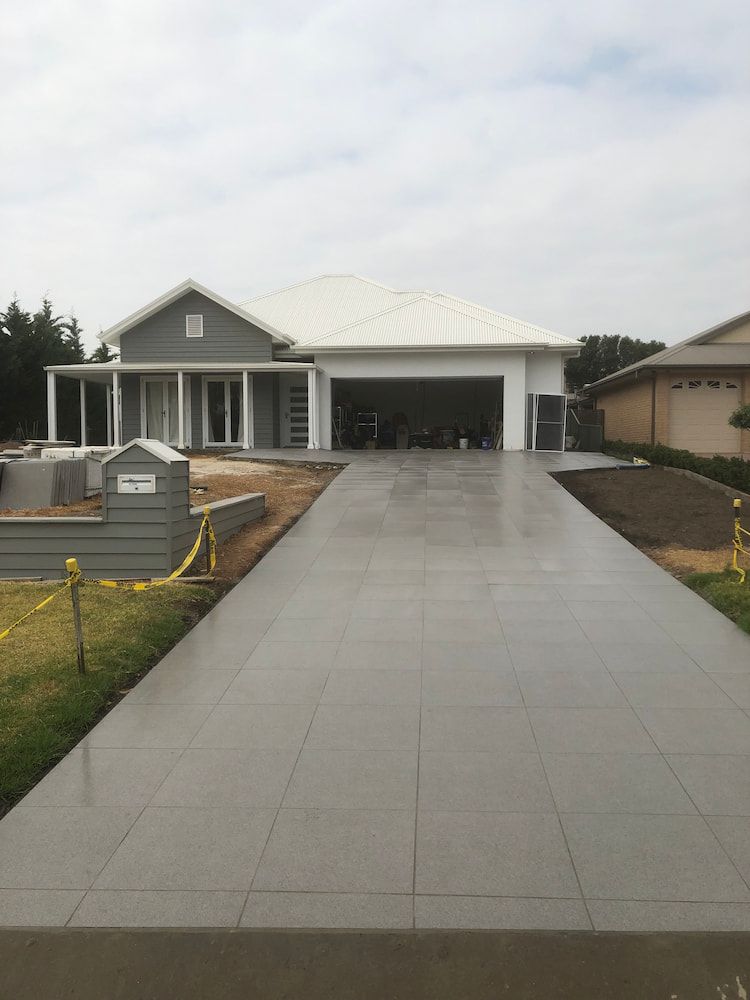 There is a Concrete Driveway Leading to a House — Peter Phillips Landscape Design in Sussex Inlet, NSW
