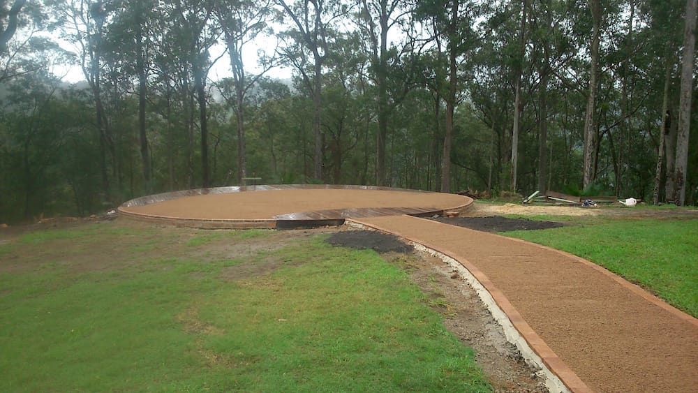 A Dirt Path Going Through a Grassy Field With Trees — Peter Phillips Landscape Design in Bomaderry, NSW