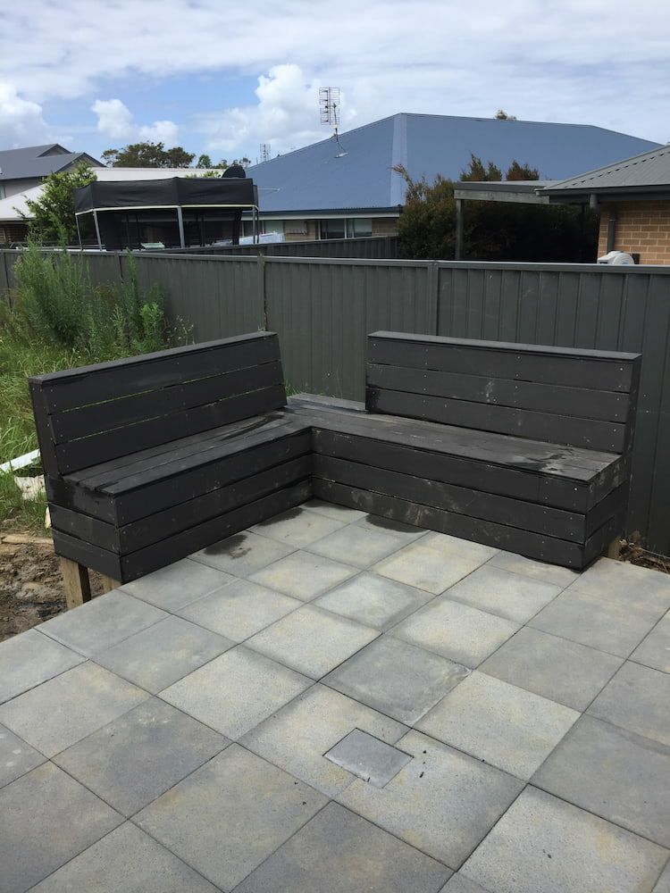 A Patio With a Bench and a Fence — Peter Phillips Landscape Design in Bomaderry, NSW