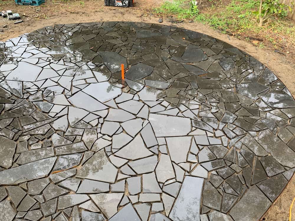 A Circular Stone Walkway is Being Built in the Dirt — Peter Phillips Landscape Design in Bomaderry, NSW