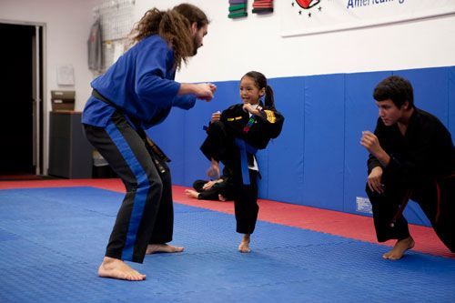 A group of kids are practicing martial arts afterschool at American Tiger Martial Arts in Westminster, CA.