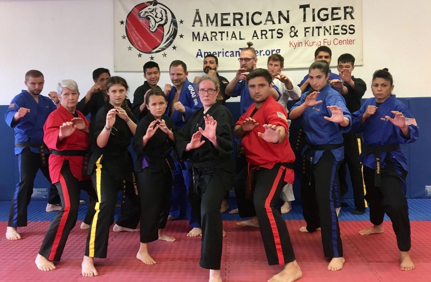 A group of students at American Tiger Martial Arts in Westminster  posing after a successful belt test