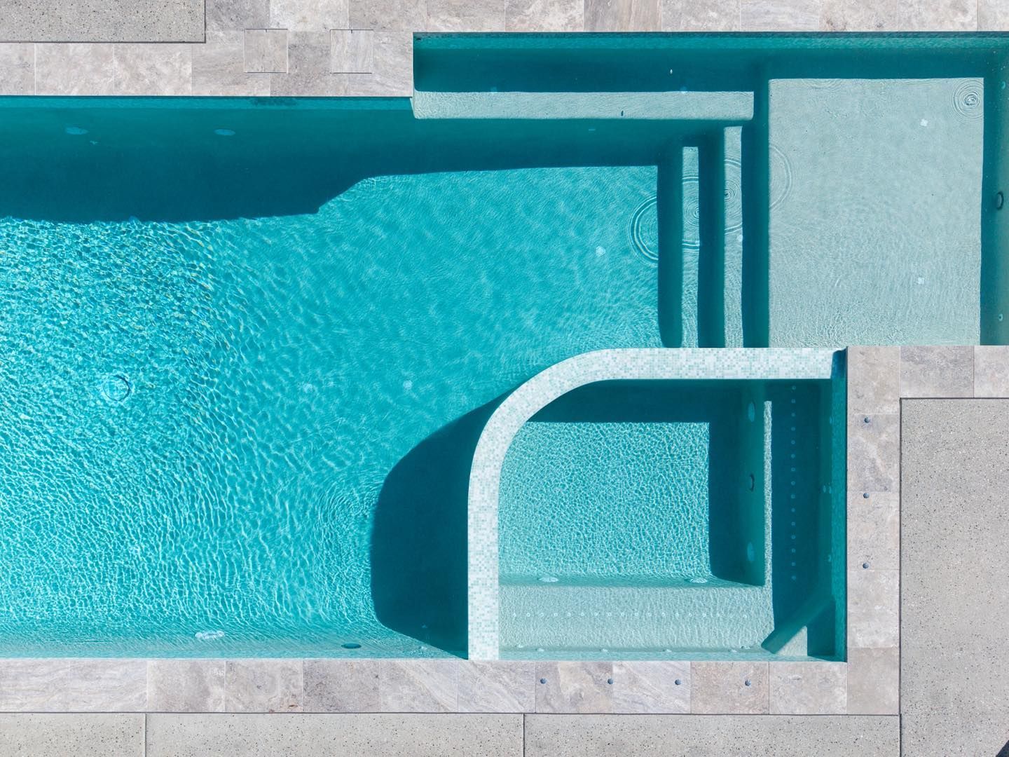 Overhead View of a Rectangular Turquoise Pool With Stairs — Mad Pool Interiors and Renovations in Baringa, QLD