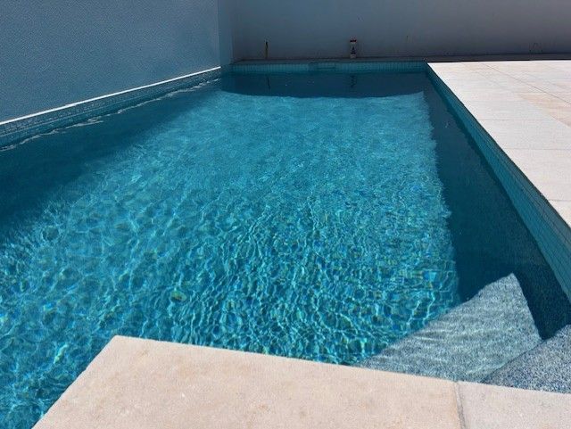 Blue Rectangular Swimming Pool With Calm Water — Mad Pool Interiors and Renovations in Baringa, QLD
