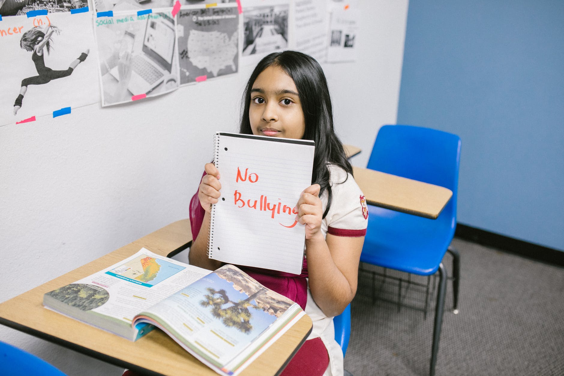 girl holding no bullying campaign